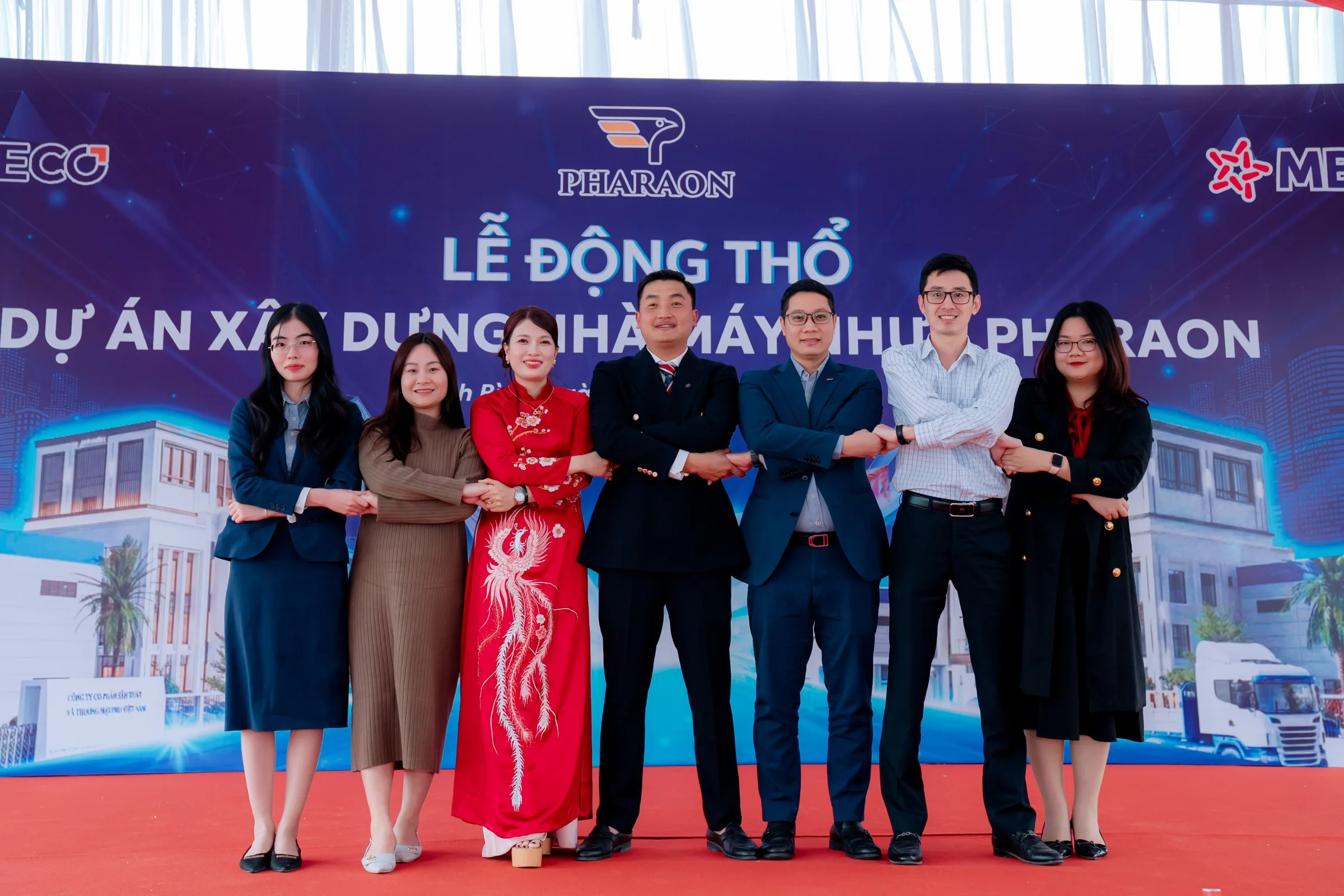 Group photograph in front of the project backdrop
