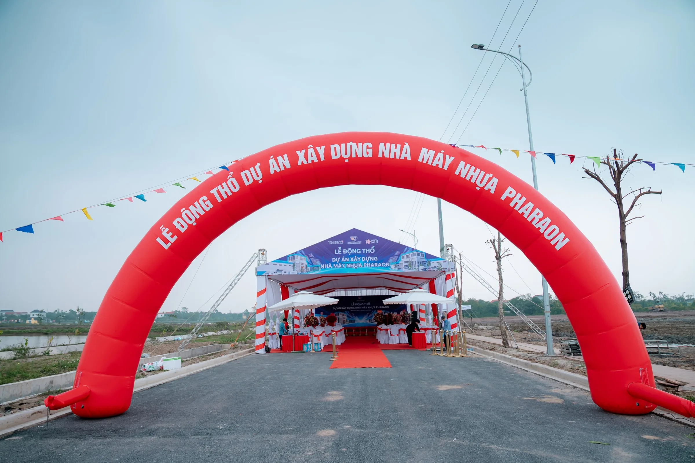 Inflatable welcome arch on the access road to the Pharaon plastics factory site in Ninh Binh