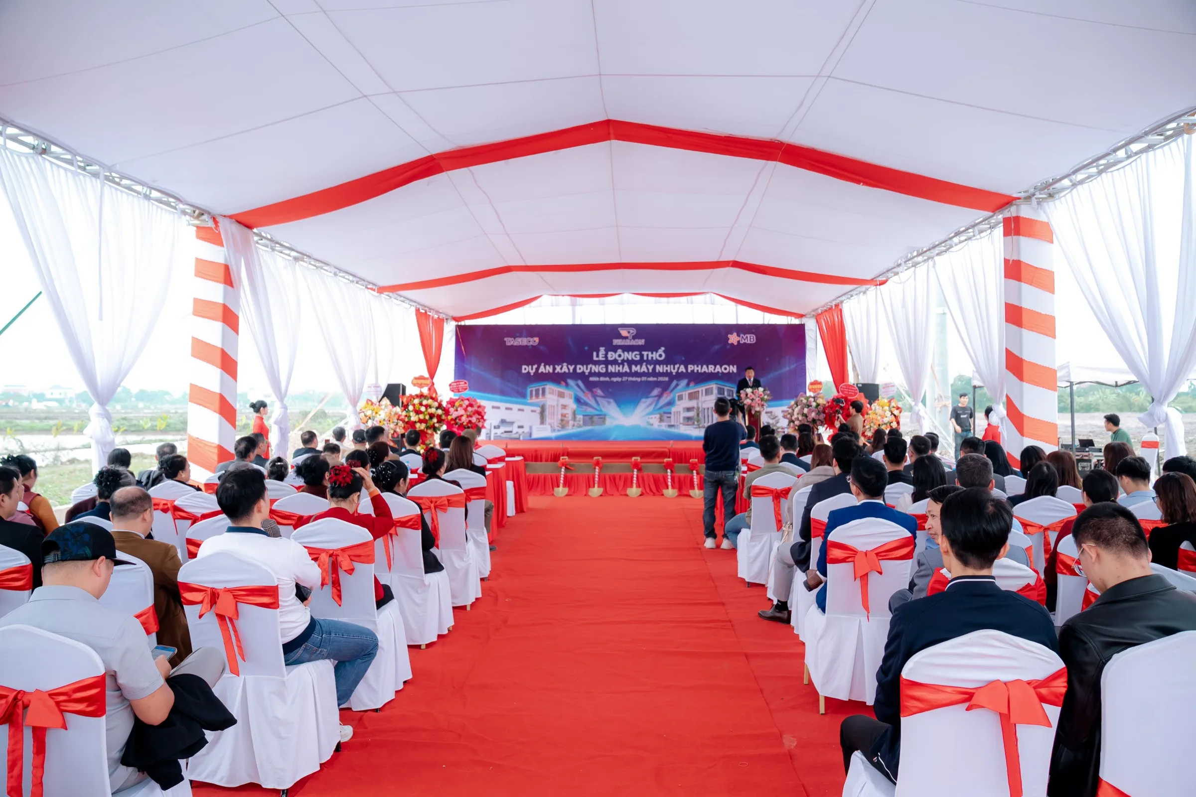 Guests seated under the marquee for the ceremony