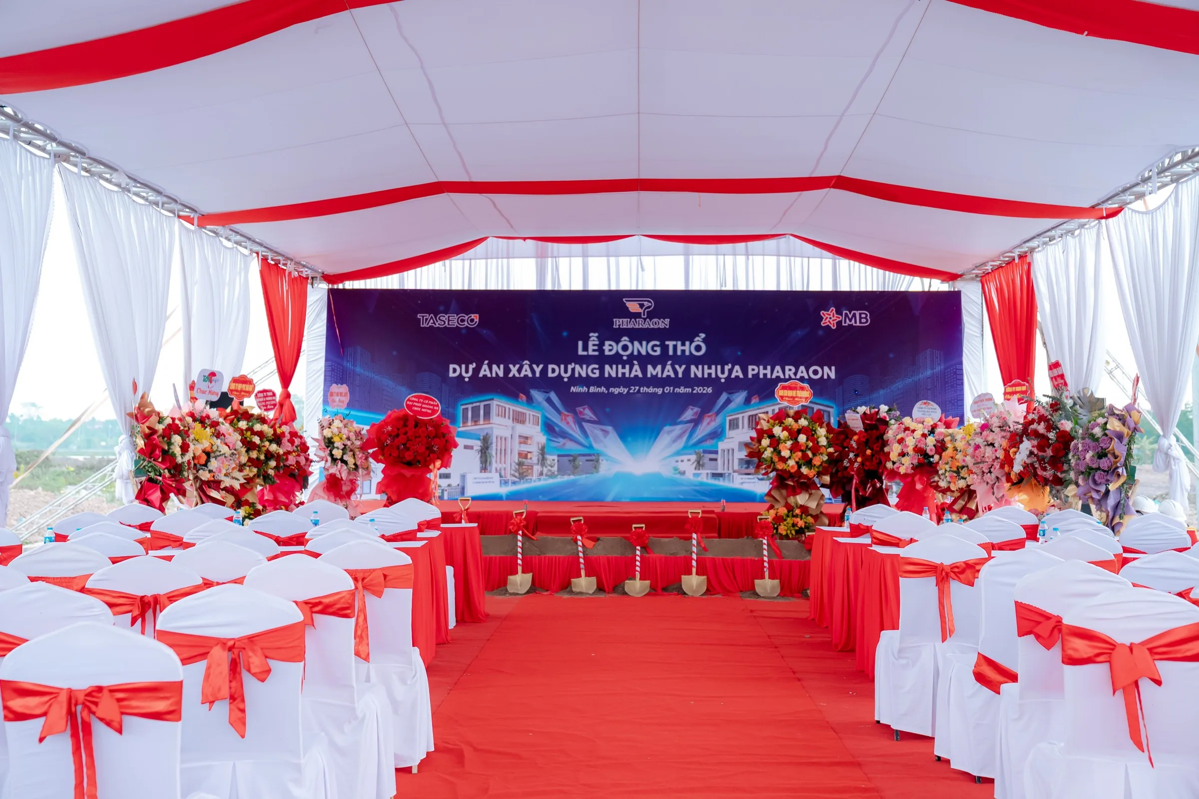 The ceremony marquee before guests arrive, stage and seating prepared