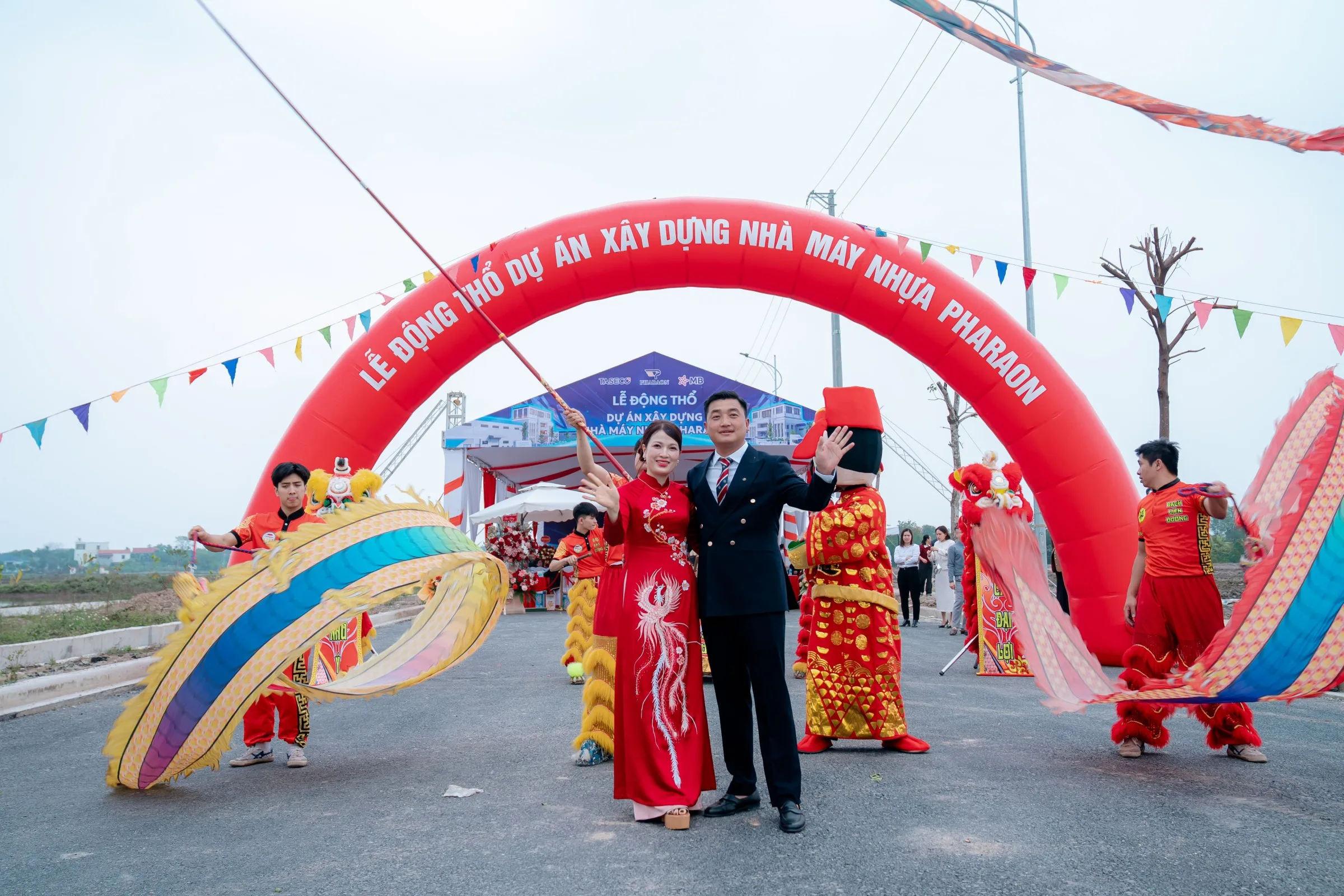 Lion dance troupe performing at the entrance arch
