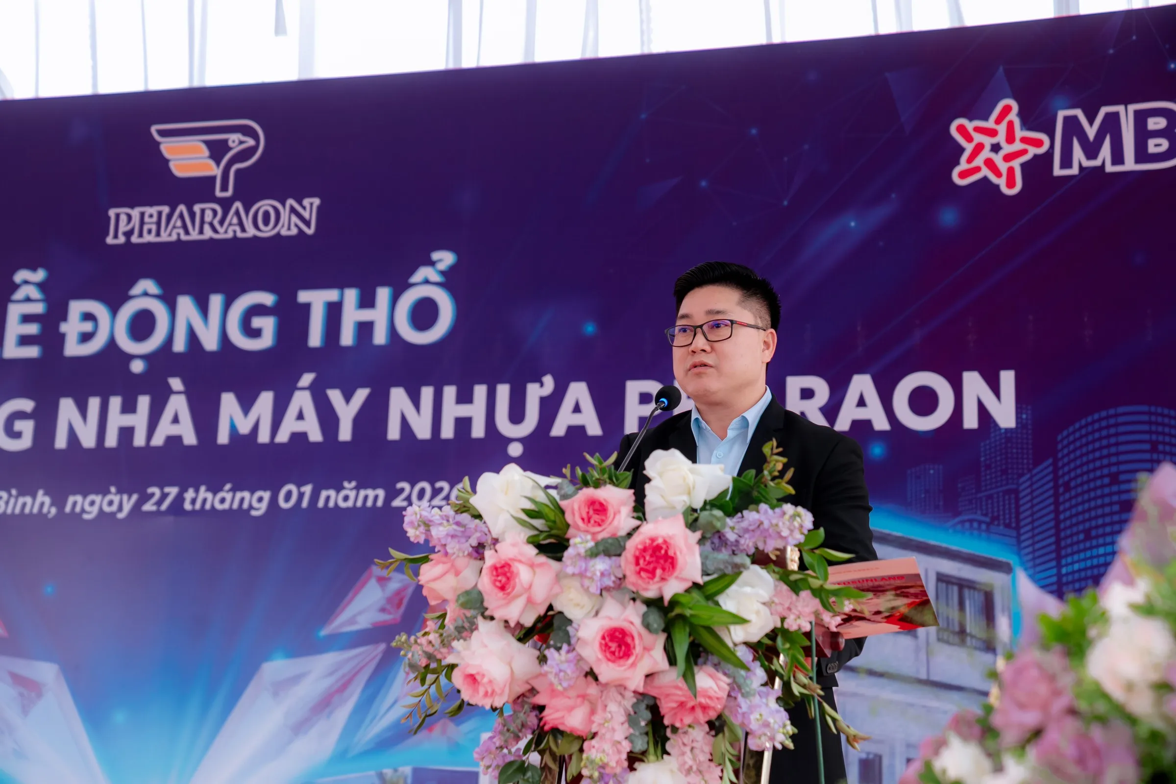 Speaker addressing the ceremony from the podium