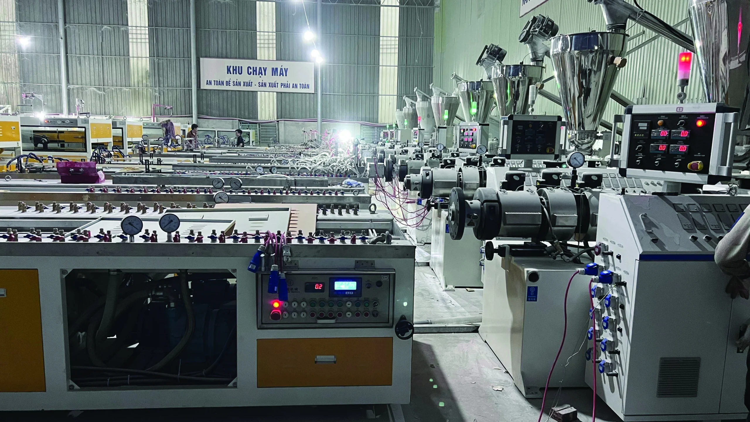 Row of extrusion line control panels at the Pharaon plant