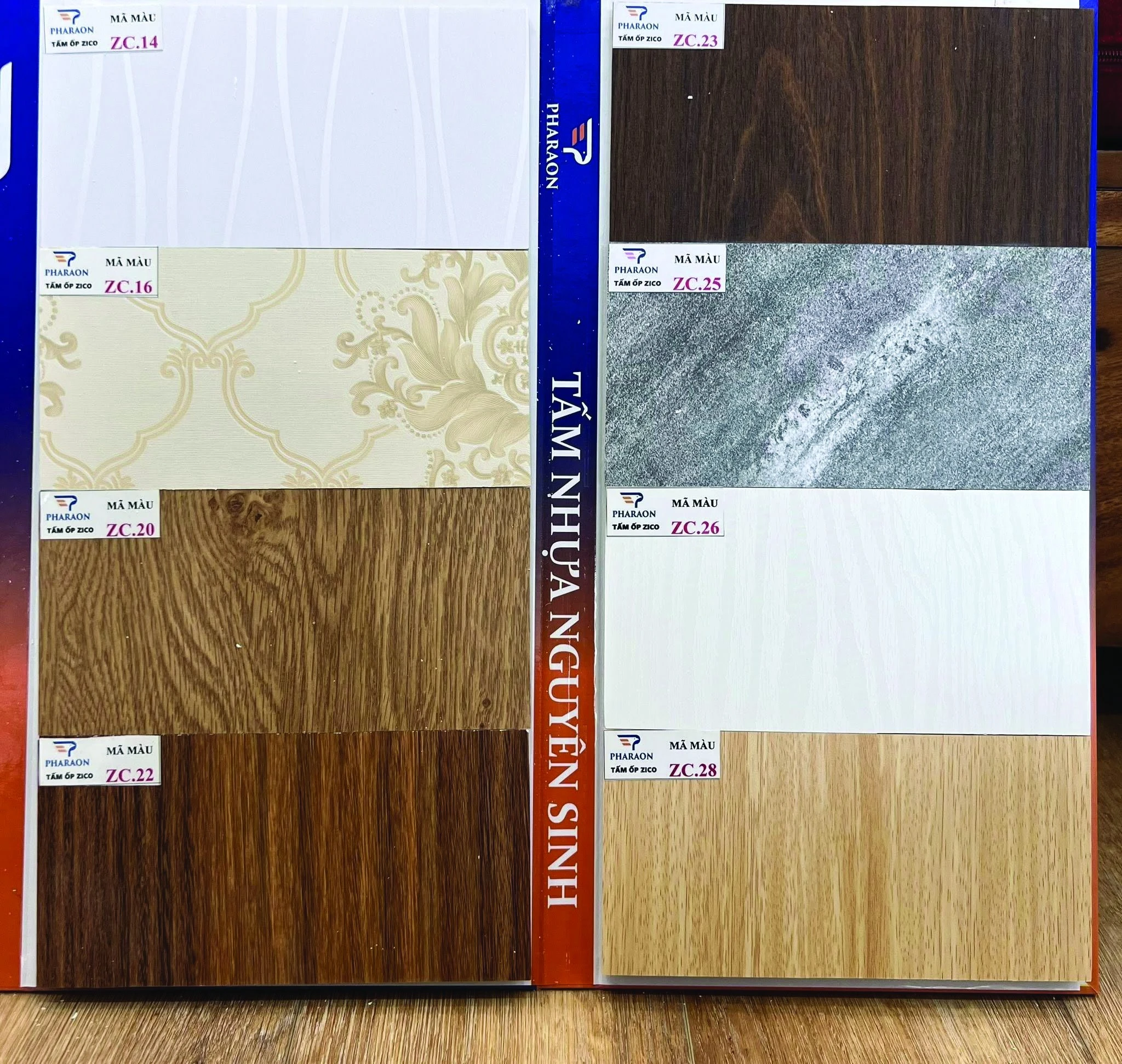 PHARAON ZICO sample book showing PVC wall panel surface finishes labelled with production codes